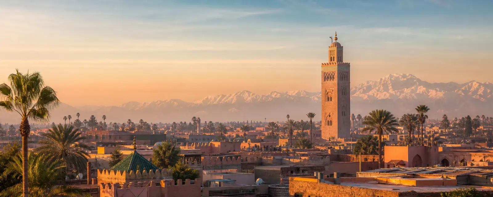Marrakech landscape with Koutoubia Mosque and the Atlas Mountains
